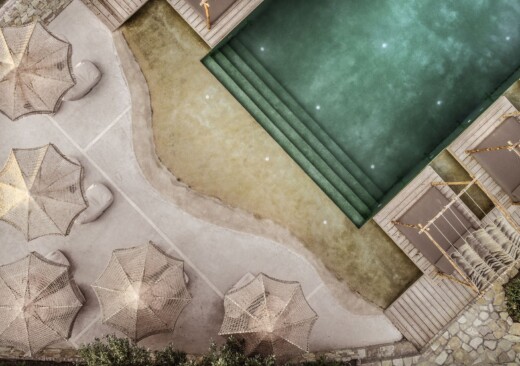 Aerial view of the main pool at at Doryssa boutique hotel in Samos