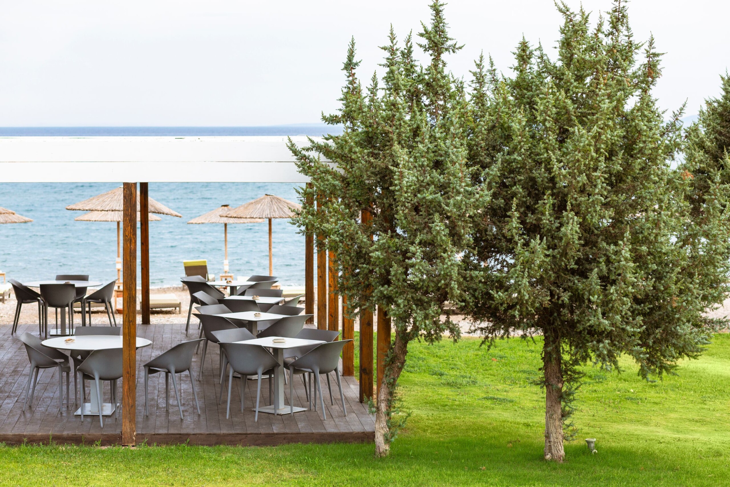 The al fresco beach bar at Doryssa Coast's beachfront luxury apartments in Samos