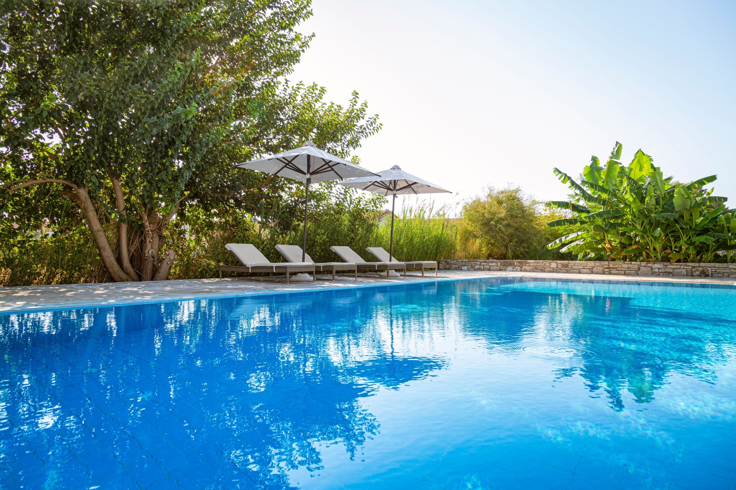 View of the main pool at Doryssa Coast with beachfront luxury apartments in Samos