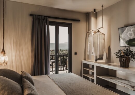 Bedroom and open wardrobe and dresser at Doryssa Boutique Hotel, suitable couples accommodation in Samos