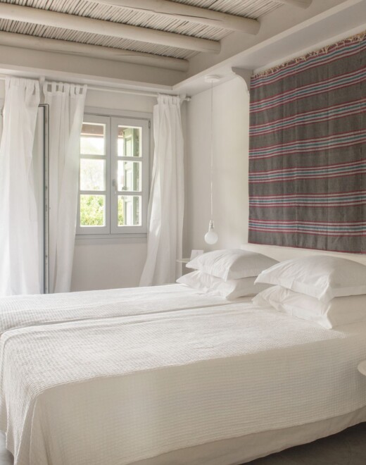 The bedroom of Doryssa Seaside Village beachfront luxury suite in Samos