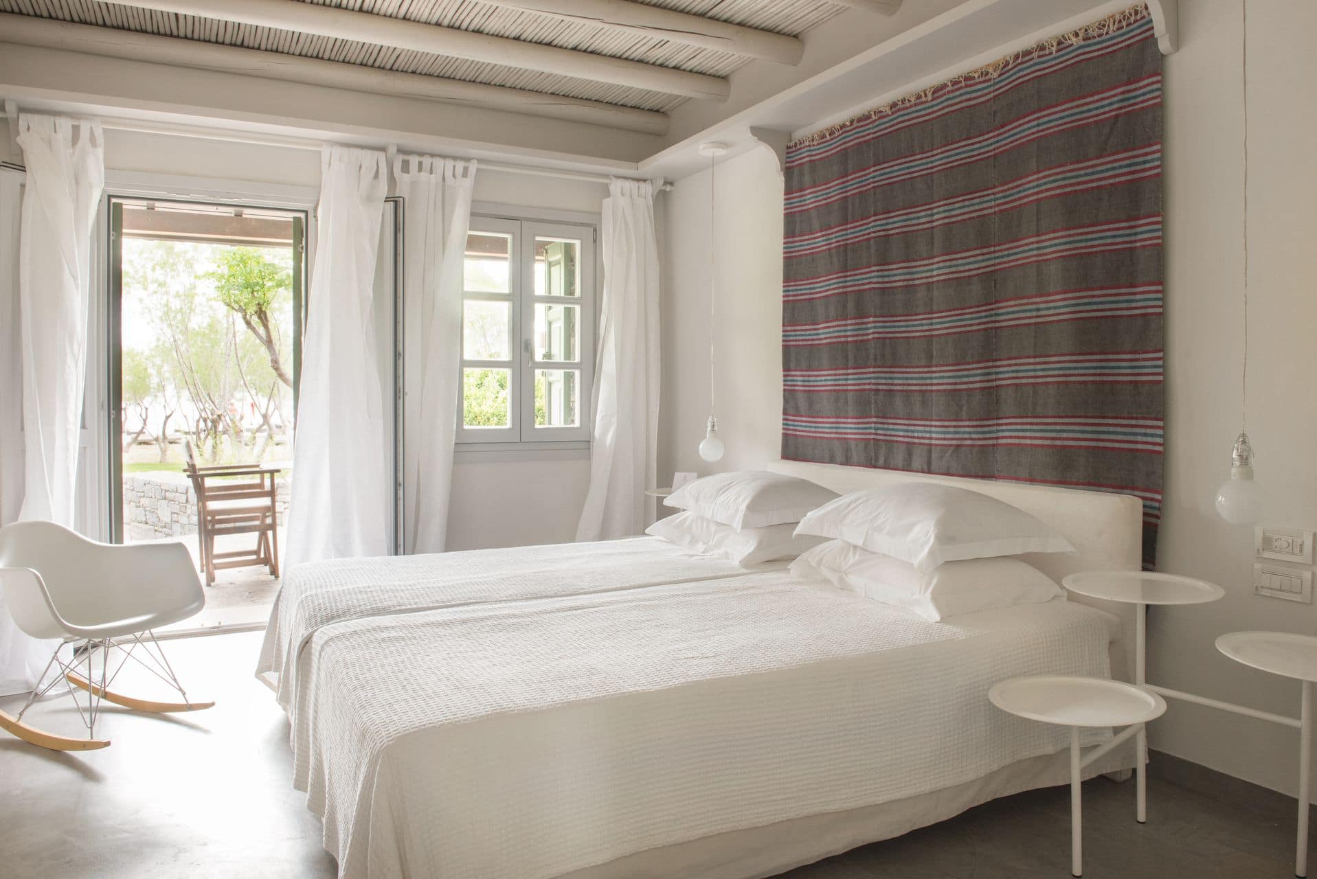 The bedroom of Doryssa Seaside Village beachfront luxury suite in Samos