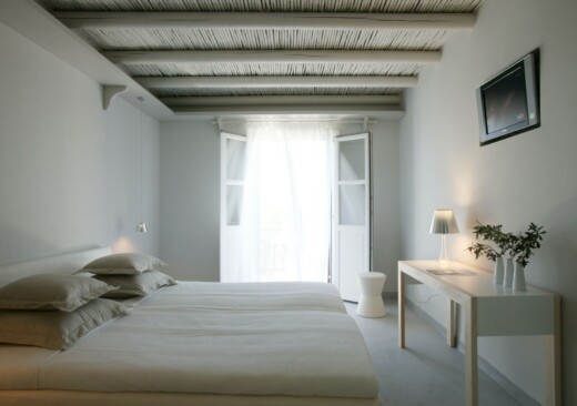 The bedroom of the Junior Suite of Doryssa Seaside Village is a delightful family seaview suite in Samos