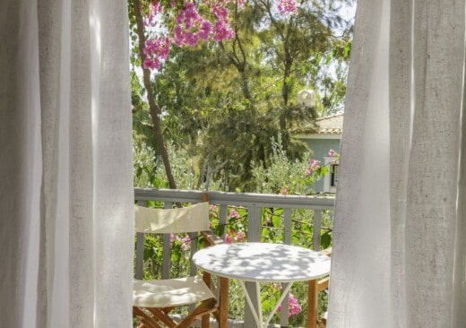Balcony overlooking the garden at the Junior Village family room garden view in Samos by Doryssa Seaside