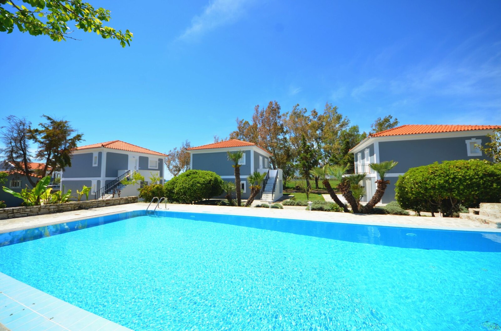 The sapphire pool of Doryssa Coast seafront luxury apartments in Samos